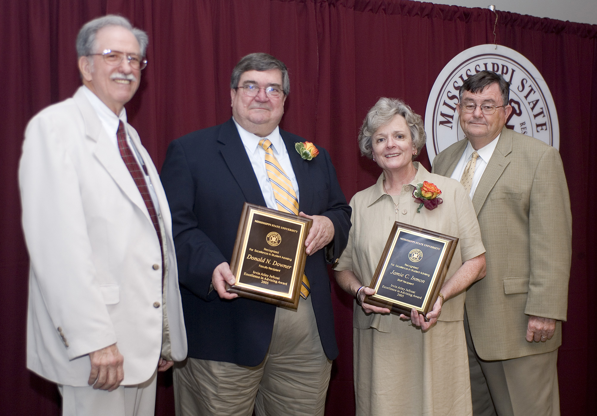 Student advisers Donald Downer (second from left) and Jamie Inmon receive congratulations from award namesake Atly Jefcoat (left) and MSU President Charles Lee. Student advisers Donald Downer (second from left) and Jamie Inmon receive congratulations from award namesake Atly Jefcoat (left) and MSU President Charles Lee.
