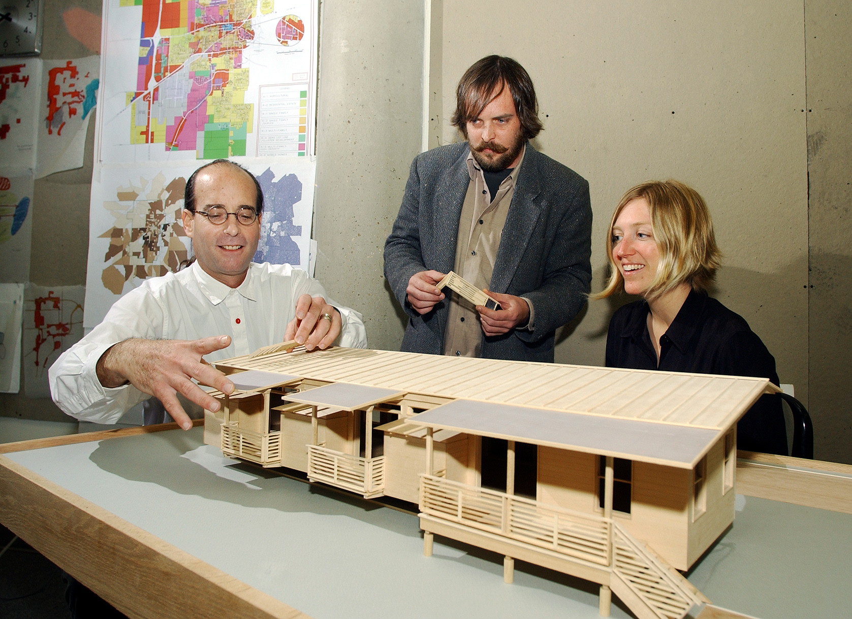 <br /><br />
Michael Berk (l) and Kimberly Brown of the Carl Small Town Center at Mississippi State look over an architectural model of the center's proposed sustainable mobile home. Architecture intern Jason Pressgrove of Jackson (c) assisted with the project. <br /><br />
Michael Berk (l) and Kimberly Brown of the Carl Small Town Center at Mississippi State look over an architectural model of the center's proposed sustainable mobile home. Architecture intern Jason Pressgrove of Jackson (c) assisted with the project.