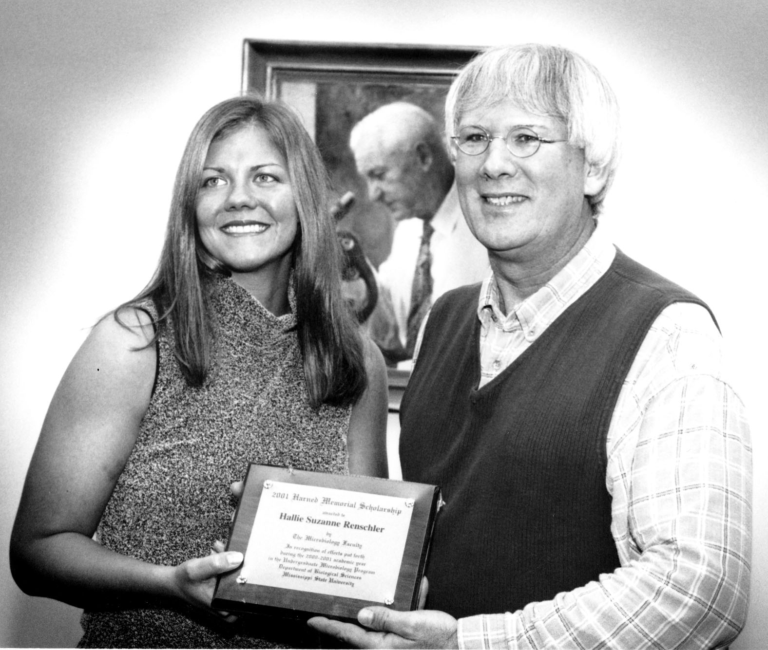 <br /><br />
Harned Scholar Hallie Renschler is congratulated by adviser Frank Champlin. <br /><br />
Harned Scholar Hallie Renschler is congratulated by adviser Frank Champlin.