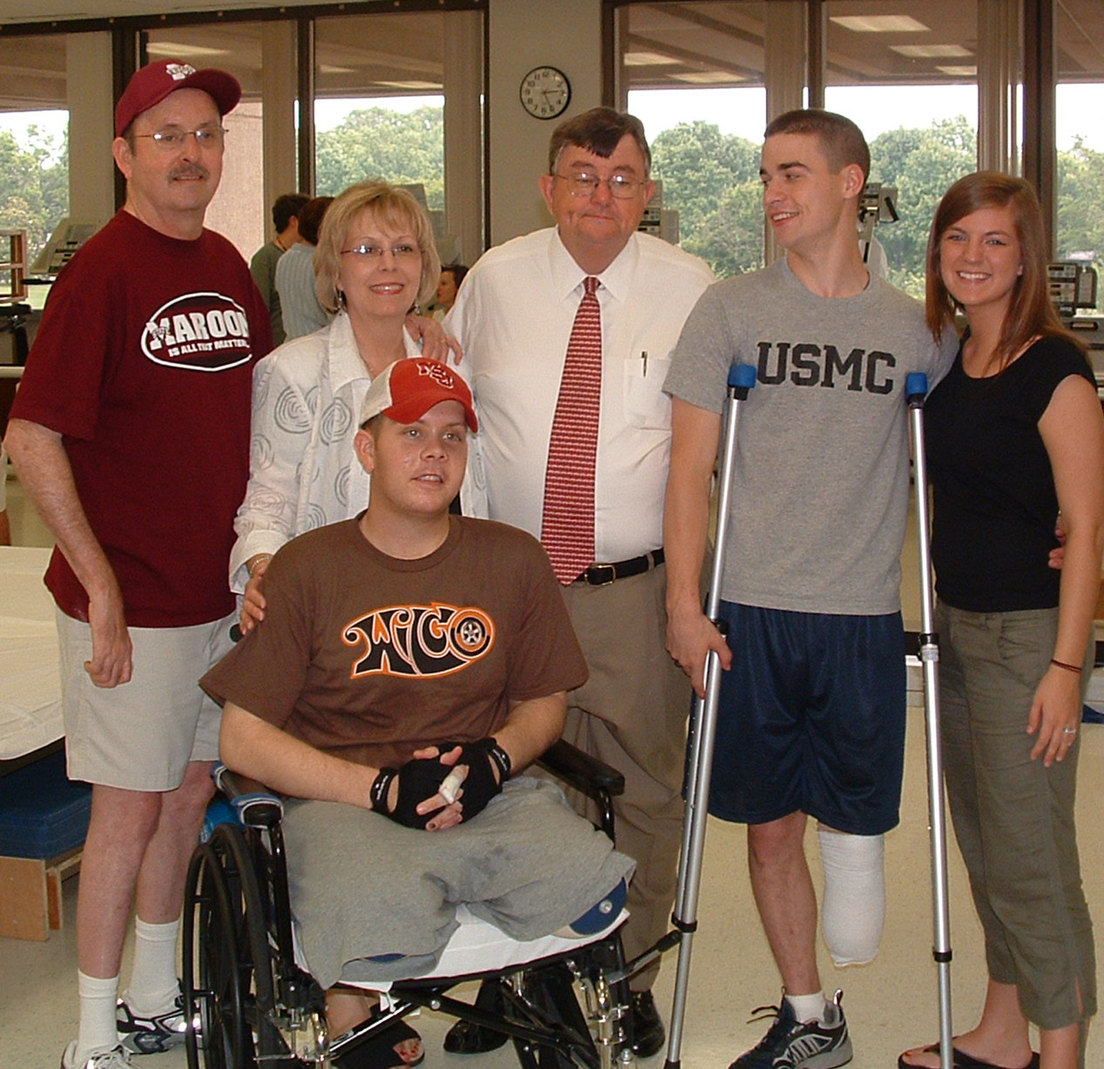 Mississippi Army National Guardsman William Brooks of Southaven (in wheelchair) and Marine reservist Aaron Rice of Sumrall (on crutches) are joined at the Walter Reed Army Medical Center in Washington, D.C., by (l-r) William's parents, Larry and Carolyn Brooks; Mississippi State University President Charles Lee; and Aaron's wife, Kelly. Marine reservist T.C. Rollins of Columbus (not pictured) was undergoing treatment at the National Naval Medical Center in Bethesda, Md. Mississippi Army National Guardsman William Brooks of Southaven (in wheelchair) and Marine reservist Aaron Rice of Sumrall (on crutches) are joined at the Walter Reed Army Medical Center in Washington, D.C., by (l-r) William's parents, Larry and Carolyn Brooks; Mississippi State University President Charles Lee; and Aaron's wife, Kelly. Marine reservist T.C. Rollins of Columbus (not pictured) was undergoing treatment at the National Naval Medical Center in Bethesda, Md.