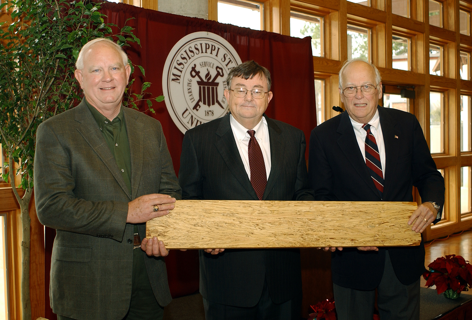 <br /><br />
During a Friday open house at Mississippi State, state Agriculture Commissioner Lester Spell (l), MSU President Charles Lee and TimTek Ltd. director Walter Jarck inspected a length of lumber produced at the TimTek demonstration plant on campus. The facility will utilize a new technology to convert strands from small-diameter pine trees into engineered lumber using adhesives, heat, and pressure <br /><br />
During a Friday open house at Mississippi State, state Agriculture Commissioner Lester Spell (l), MSU President Charles Lee and TimTek Ltd. director Walter Jarck inspected a length of lumber produced at the TimTek demonstration plant on campus. The facility will utilize a new technology to convert strands from small-diameter pine trees into engineered lumber using adhesives, heat, and pressure