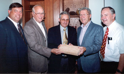 <br /><br />
Forest Products professors Dan Seale (l) and Terry Sellers (r) look over a board with TimTek directors (l to r) Walter Jarck, Geoff Sanderson and Dave Mortensen. <br /><br />
Forest Products professors Dan Seale (l) and Terry Sellers (r) look over a board with TimTek directors (l to r) Walter Jarck, Geoff Sanderson and Dave Mortensen.